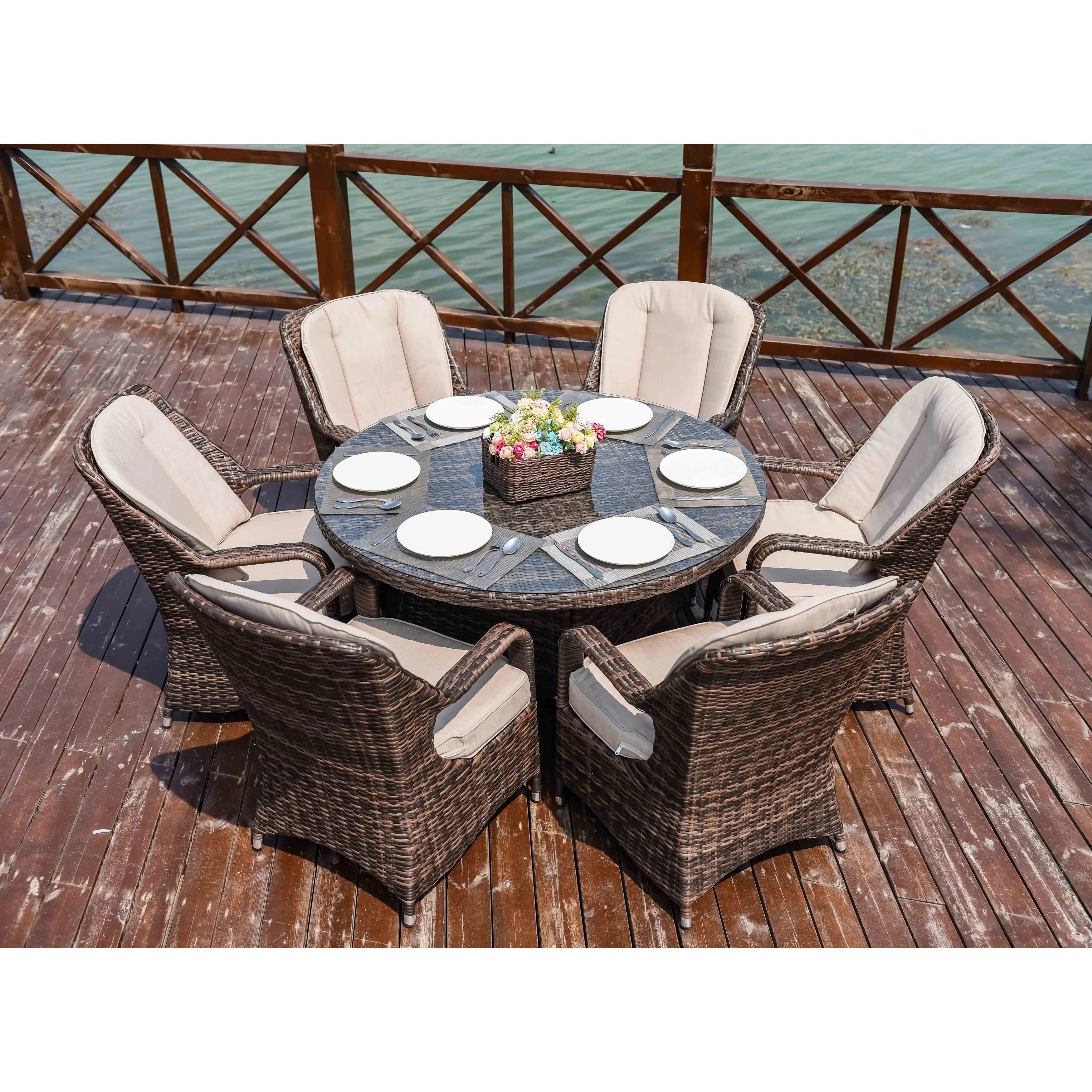 Set da pranzo rotondo da esterno in 7 pezzi in vimini di rattan con cuscini di Moda Furnishings