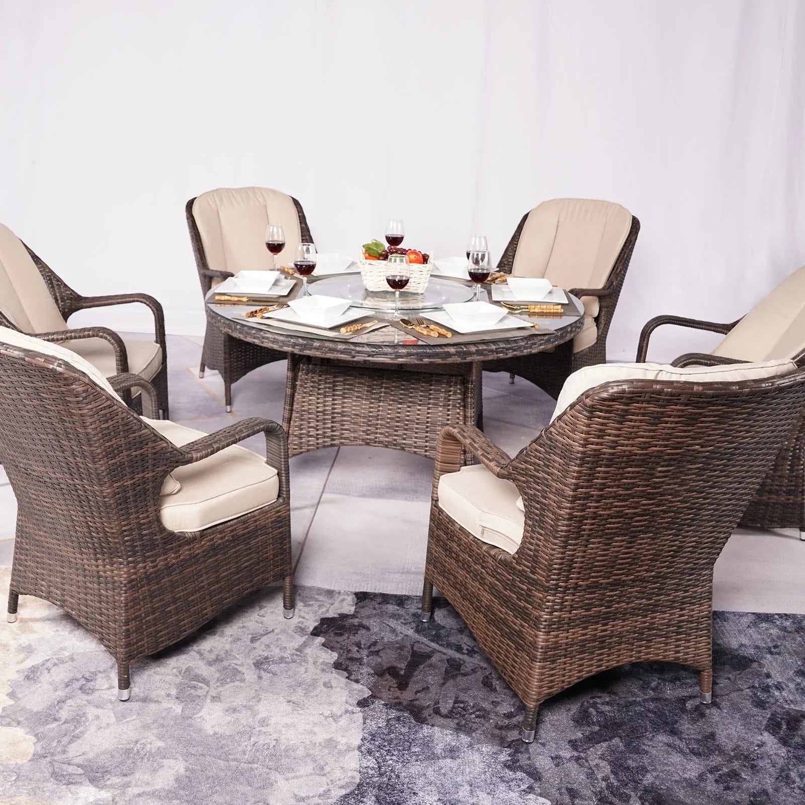 Set da pranzo rotondo da esterno in 7 pezzi in vimini di rattan con cuscini di Moda Furnishings